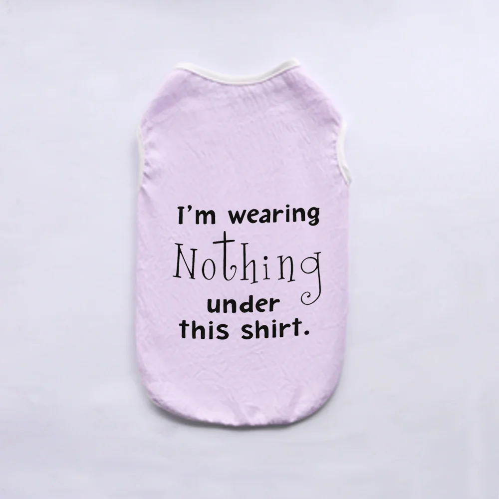 A light purple pet vest with black text that reads I'm wearing Nothing under this shirt.