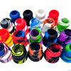 A collection of colorful silicone bat grip knobs in various colors including blue, red, green, and black.