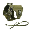 Olive green tactical dog harness with collar and MOLLE pouches shown from the side.