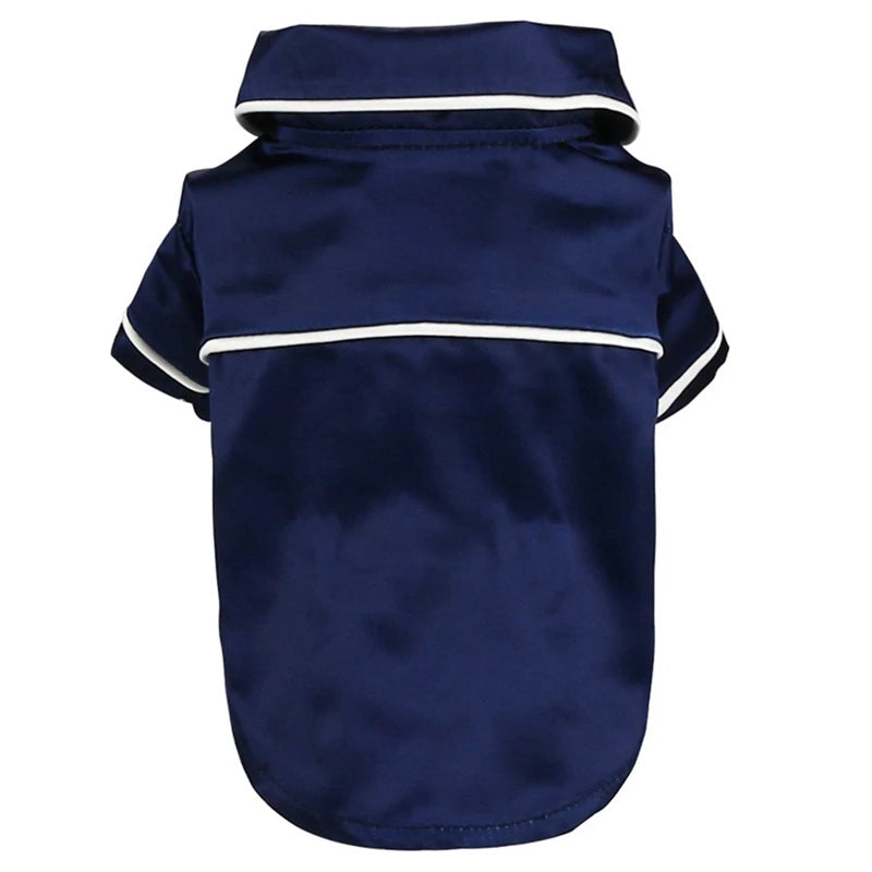 Navy blue luxury silk pet pajamas for a small dog with white trim