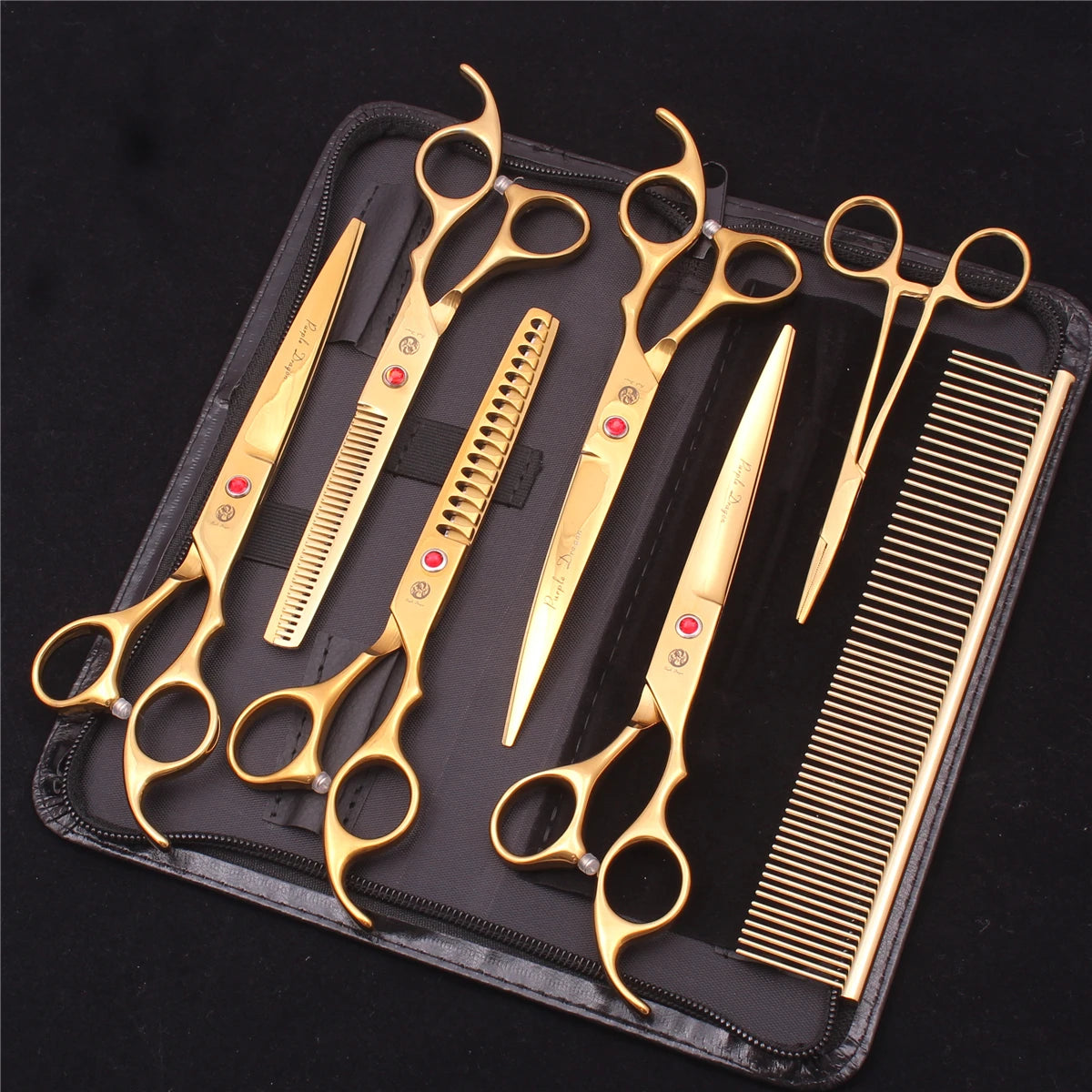 A set of professional stainless steel pet grooming scissors and combs stored in a black case.