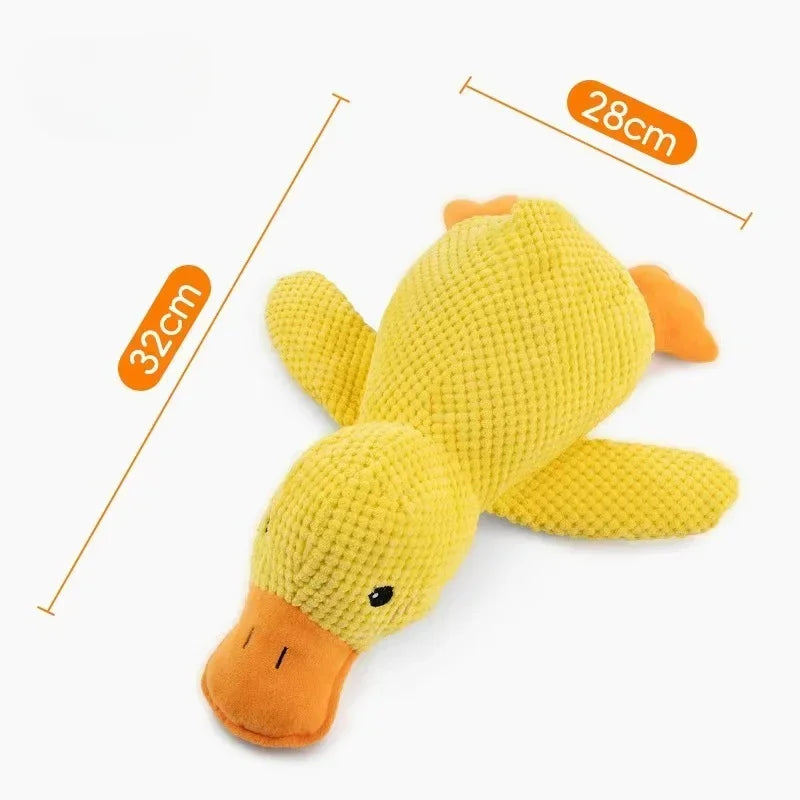 A yellow plush duck toy designed as a grinding chew toy for dogs.