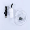 A white portable USB aquarium air pump with a black cord and a clear silicone tube.