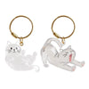A clear silicone cat figurine keychain with a gold-colored loop and jump ring.