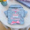 A light blue denim jacket decorated with pink embroidery of a crown and the word Princess for dogs