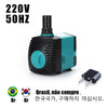 A black and teal submersible water pump with a power cord is shown next to its plug.