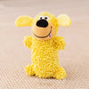 A yellow plush dog toy with large floppy ears and a black nose on a beige background.