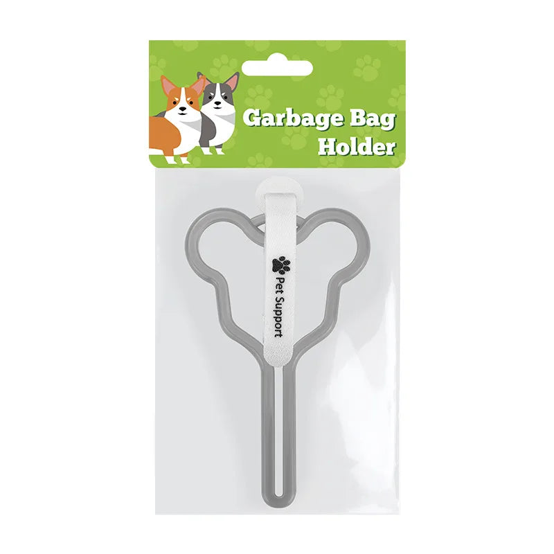 A clear plastic holder for a garbage bag, featuring a metal clip and a white handle.