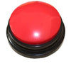 A round, bright red button with a black base for dog training.