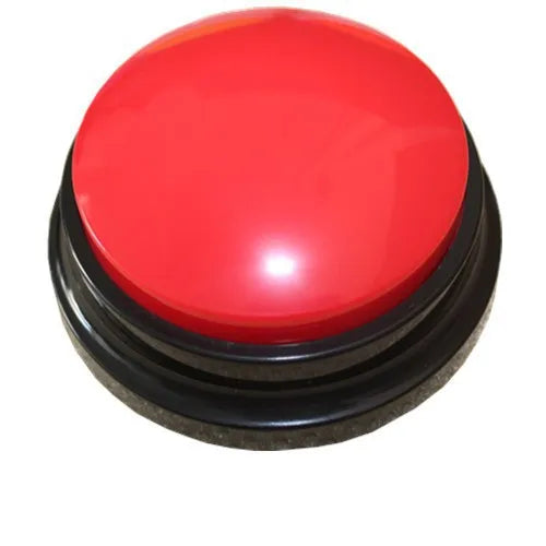 A round, bright red button with a black base for dog training.