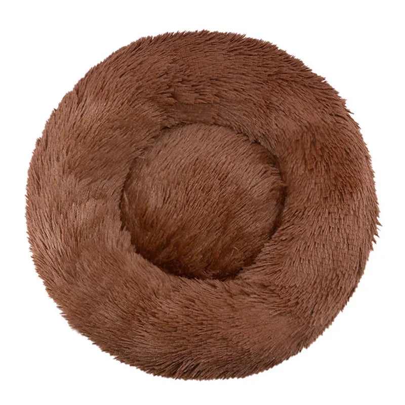 A round, brown, ultra-soft plush pet bed for dogs and cats.