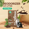A brown bag of Coconut deodorizer cat litter powder with green leaves and coffee beans scattered around.