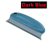 A dark blue portable lint and pet hair remover brush with a silver blade.