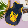 A navy blue breathable mesh pet vest featuring a yellow Pikachu cartoon print, displayed on a light purple surface.