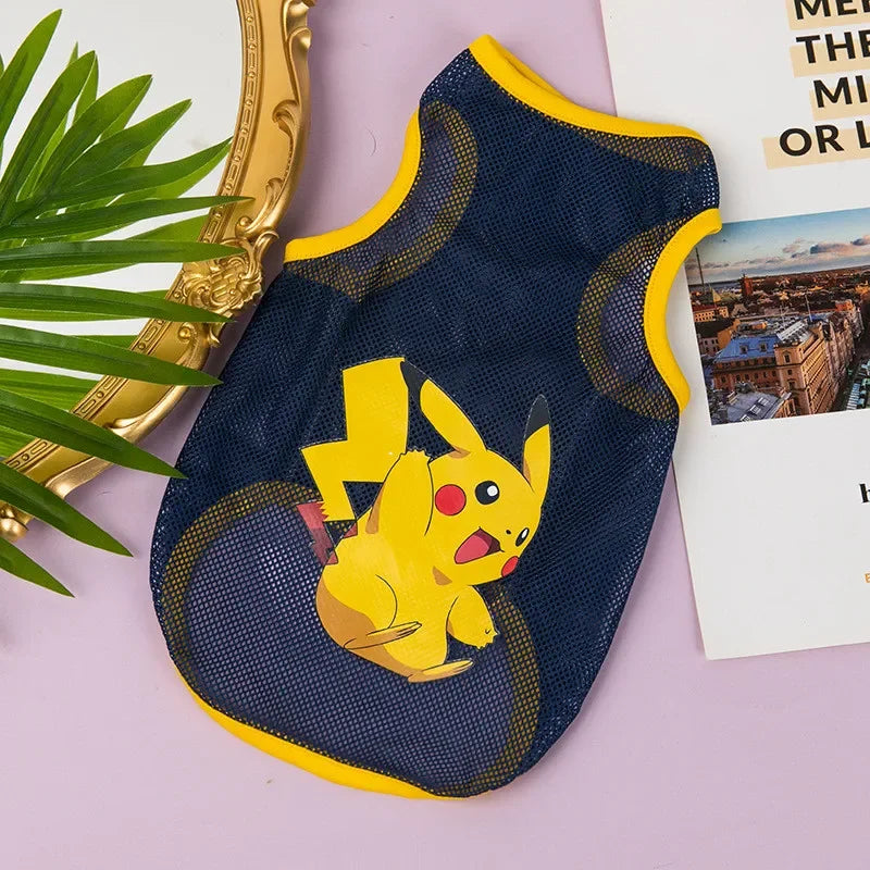 A navy blue breathable mesh pet vest featuring a yellow Pikachu cartoon print, displayed on a light purple surface.