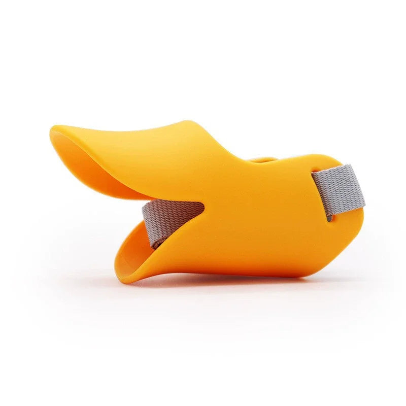 An orange soft silicone dog muzzle designed for small to medium dogs.