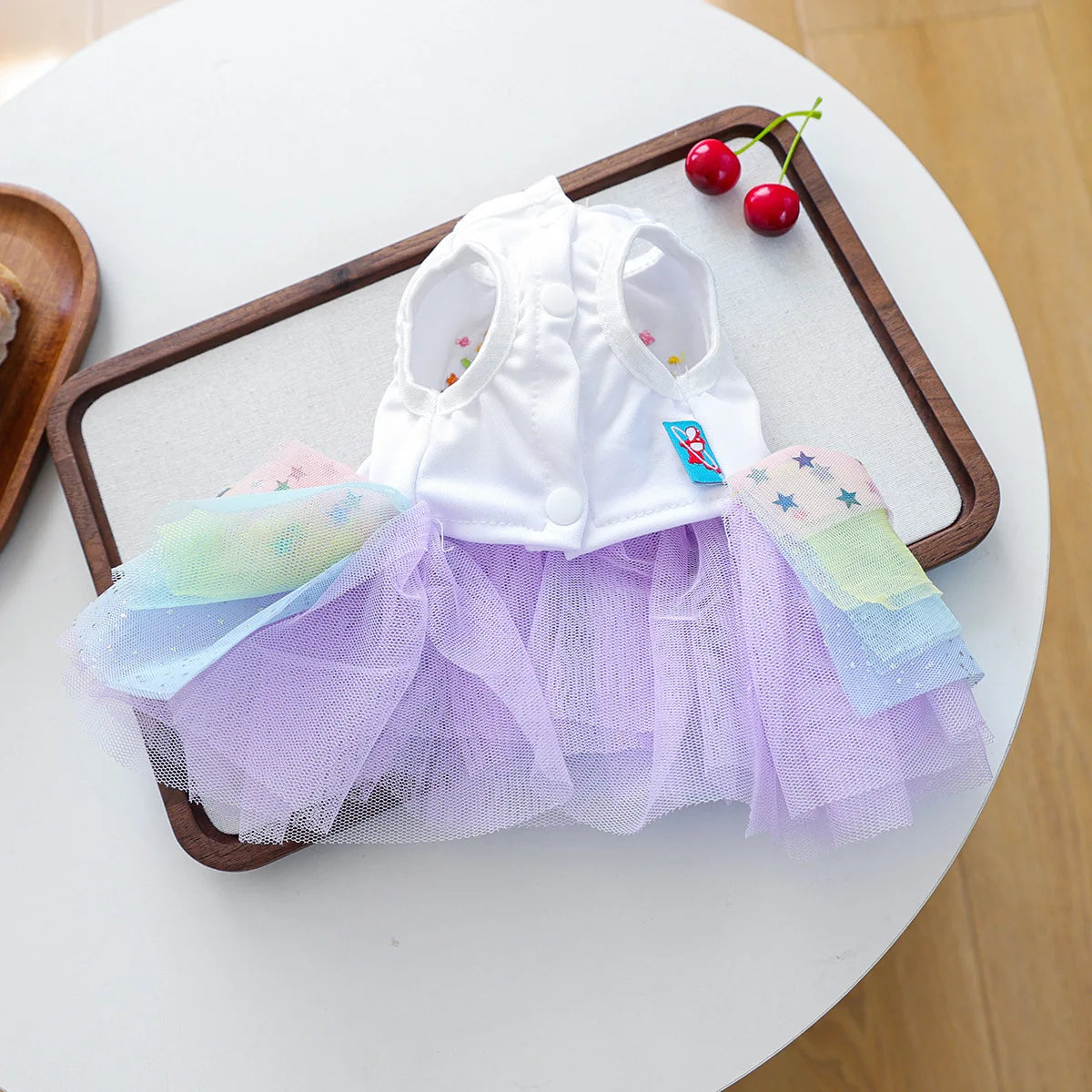 Elegant birthday suit for dogs featuring a white top and purple tulle skirt