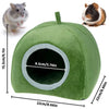 A green plush cave bed for small animals, shown with a hamster and a guinea pig.