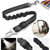 A set of black reflective dog seat belts and an adjustable nylon harness for pets.