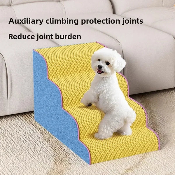 White dog standing on yellow foam puppy stairs and ramps for climbing protection joints