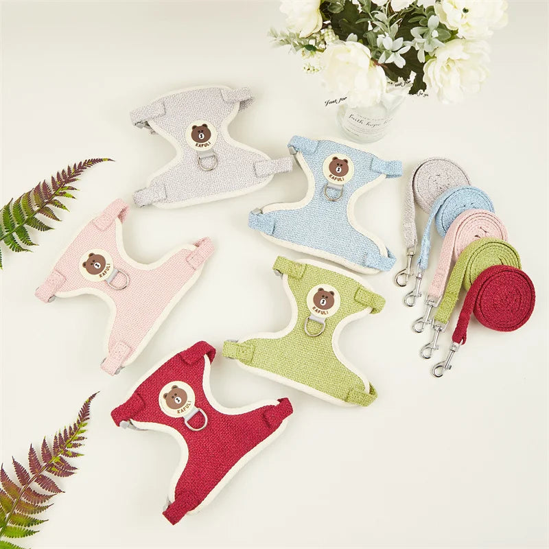 A collection of padded rabbit harness and leash sets in various pastel colors, including pink, blue, green, and red.