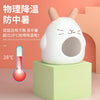 A white ceramic hamster house designed for cooling, sitting on a light green block next to a thermometer showing 28 degrees C