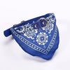 A royal blue bandana collar with white paisley embroidery and a silver buckle, designed as an adjustable pet bandanna.