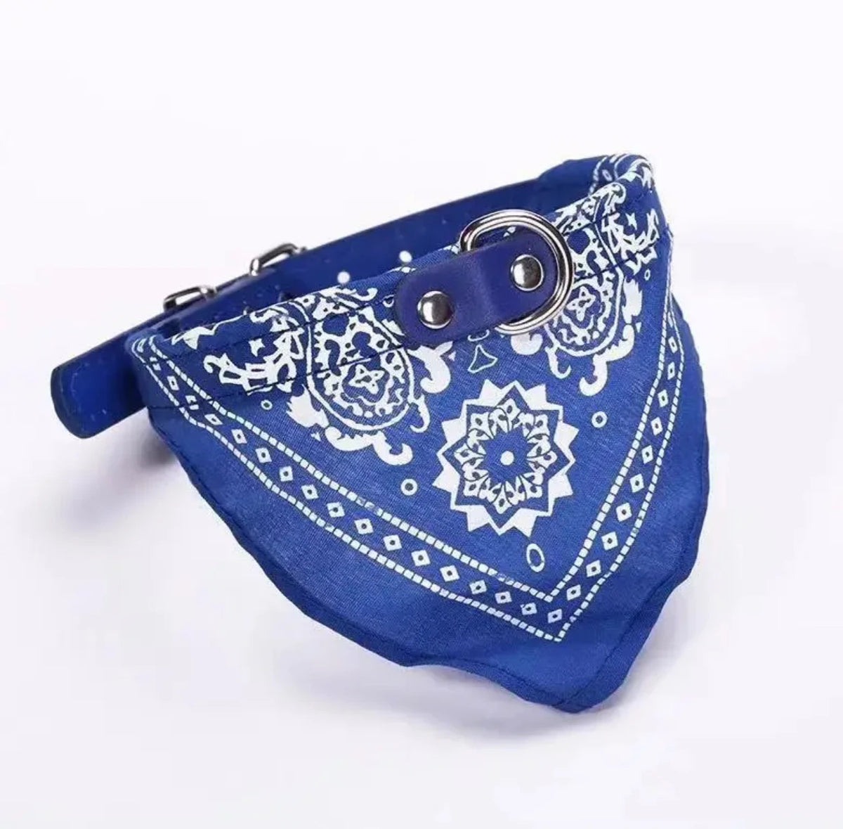 A royal blue bandana collar with white paisley embroidery and a silver buckle, designed as an adjustable pet bandanna.