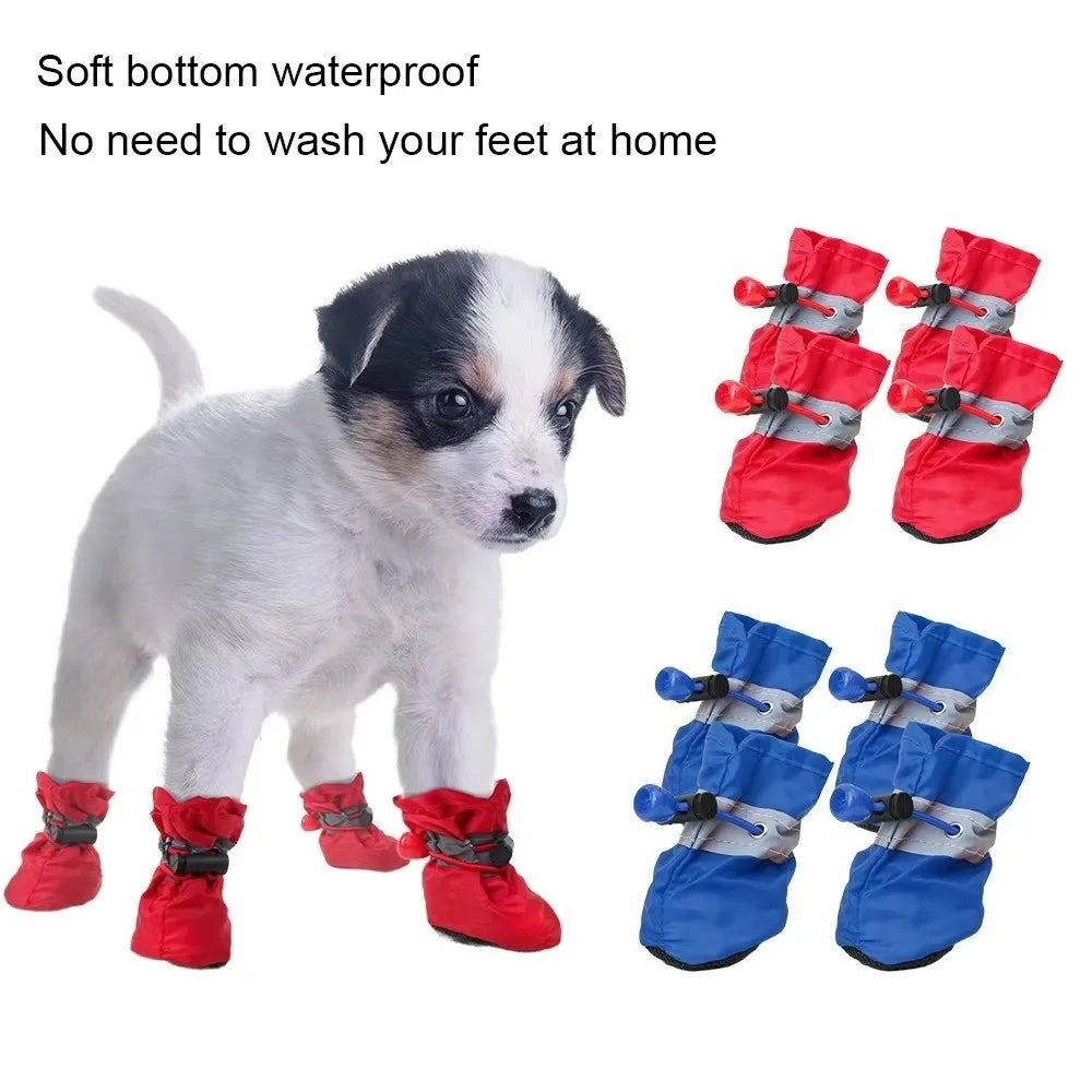A set of red and blue soft bottom waterproof dog booties with reflective grip for keeping feet at home