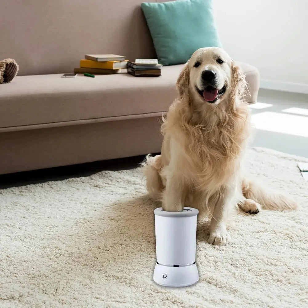 A golden retriever sits next to a white automatic pet paw cleaner cup on a light-colored rug.