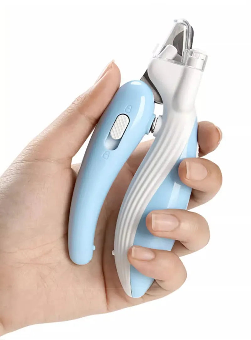 A hand holds a light blue LED pet nail clipper tool designed for dogs and cats.