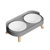 A gray stainless steel double bowl for dogs and cats with a wooden stand.