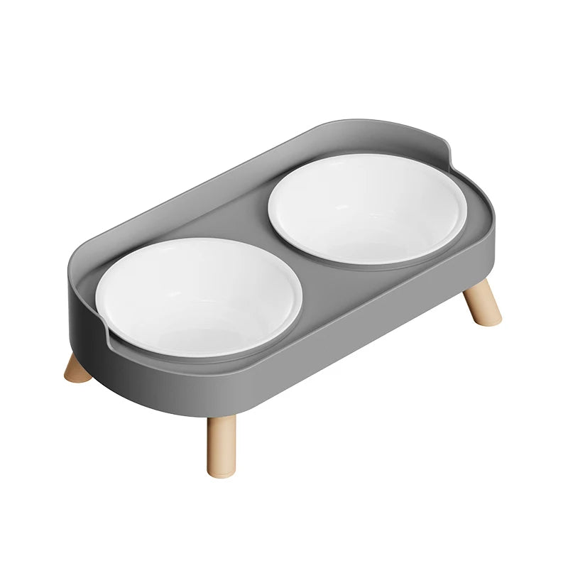 A gray stainless steel double bowl for dogs and cats with a wooden stand.