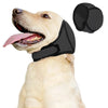 A light-colored dog is wearing a black noise reduction ear muff on its head.