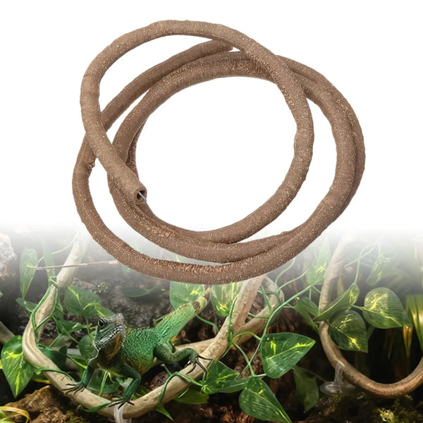 A coiled brown artificial reptile vine used for terrarium decor, resting on green foliage.