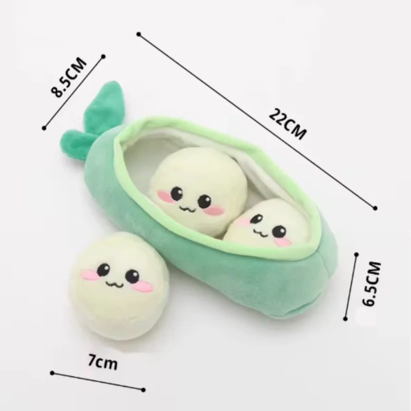 A soft green plush toy shaped like a sausage dog with a floppy ear and small white accents.