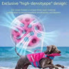 A dog wearing a bright pink life jacket is running through the water.