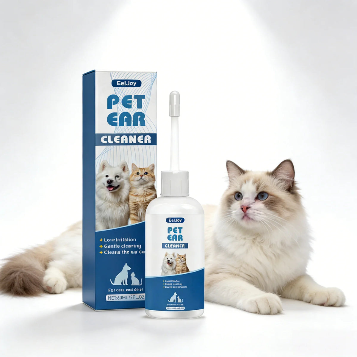 Eine Flasche Pet Ohrreiniger-Lösung neben einer Box mit einer flauschigen Katze.