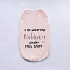 A light pink breathable summer pet vest with black text that reads I'm wearing Nothing under this shirt.