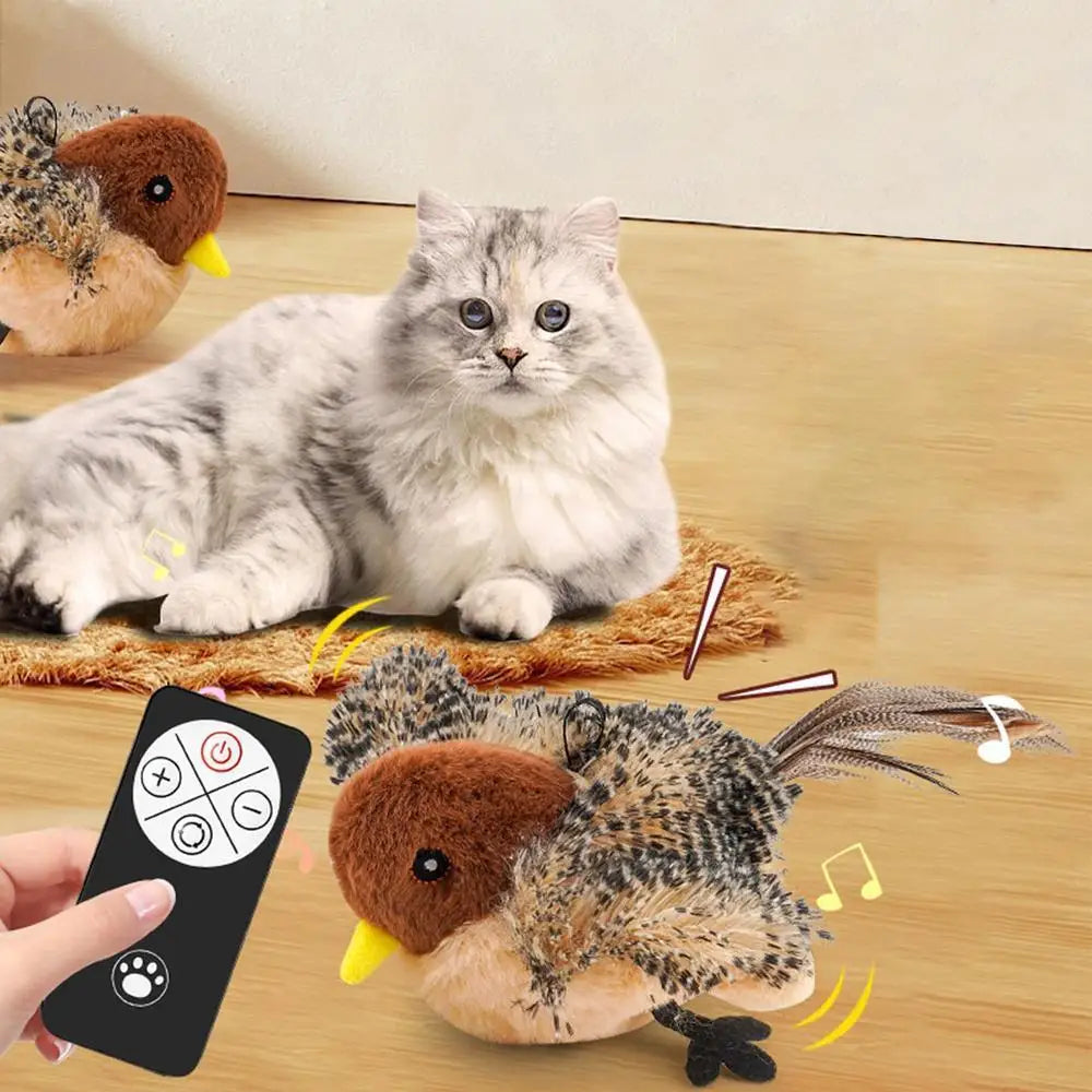 A fluffy gray cat toy resembling a bird is shown next to a remote control, demonstrating an interactive flapping toy.