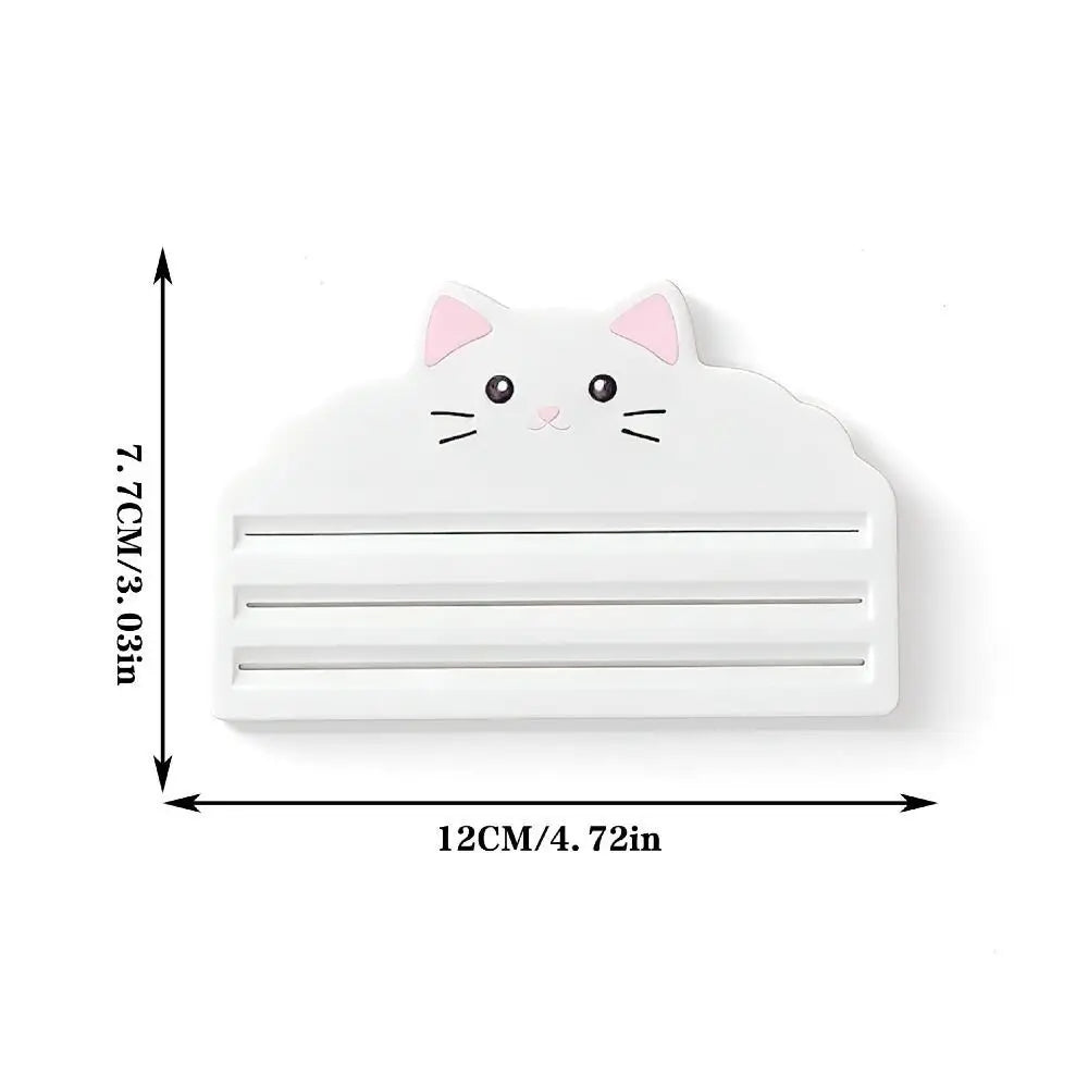 White reusable cat food pouch scraper shaped like a cat face