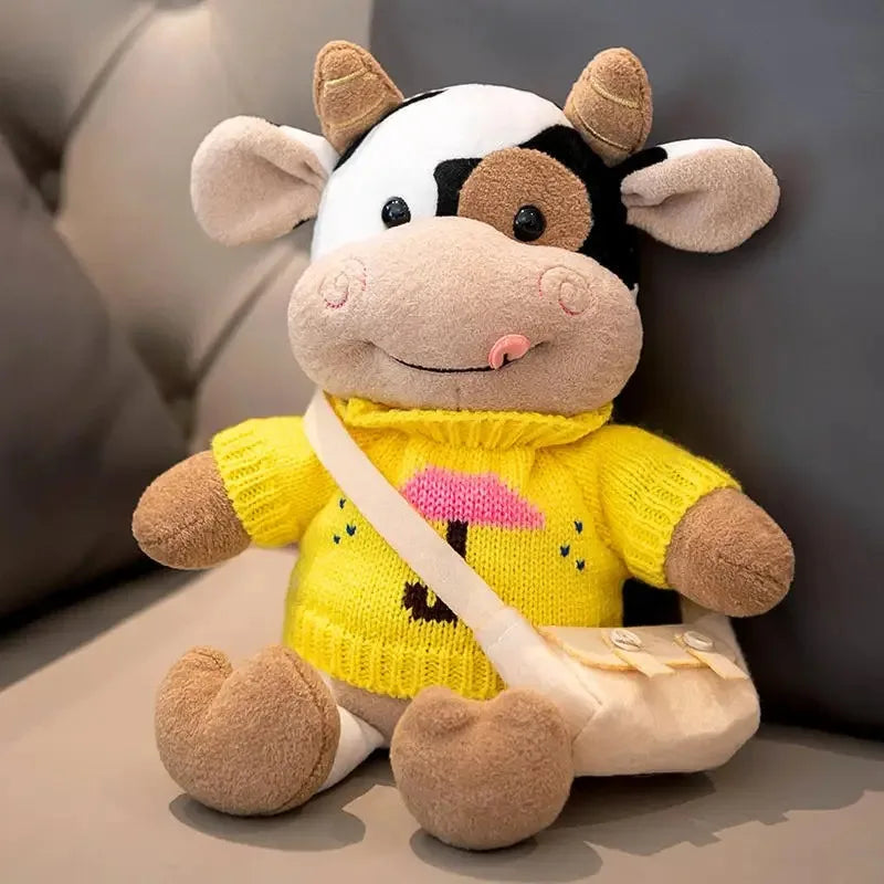 A yellow and white cow plush toy with brown accents, sitting on a light surface.