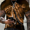 A man wearing a brown Jesus graphic print crew neck t-shirt and dark jeans, holding a smartphone.