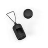 A black portable dog poop bag dispenser with a long string attached.
