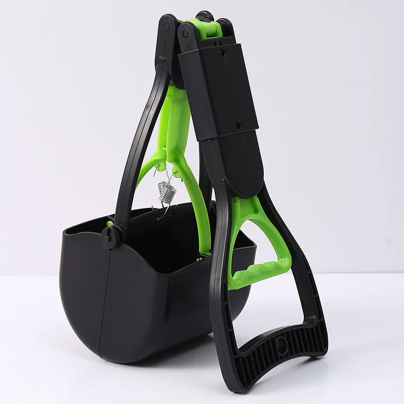A black and lime green portable foldable dog poop scooper with a handle and container.