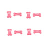 A set of pink bone-shaped hair clips used for pet grooming.