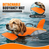 An orange and gray detachable buoyancy mat life jacket for a dog floating in the water.