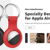 A black silicone protective cover for an Apple AirTag with a silver keychain ring.