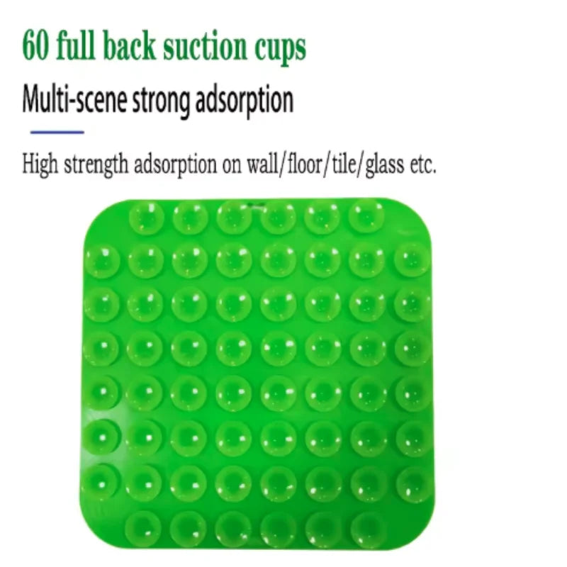A green silicone suction cup mat with multiple circular suction cups for various surfaces.