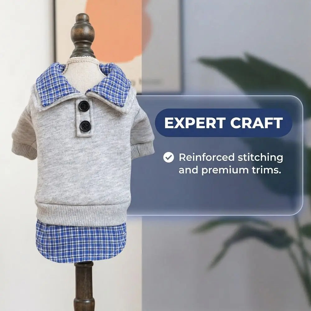A gray and blue plaid dog hoodie displayed on a wooden mannequin, highlighting expert craft stitching.